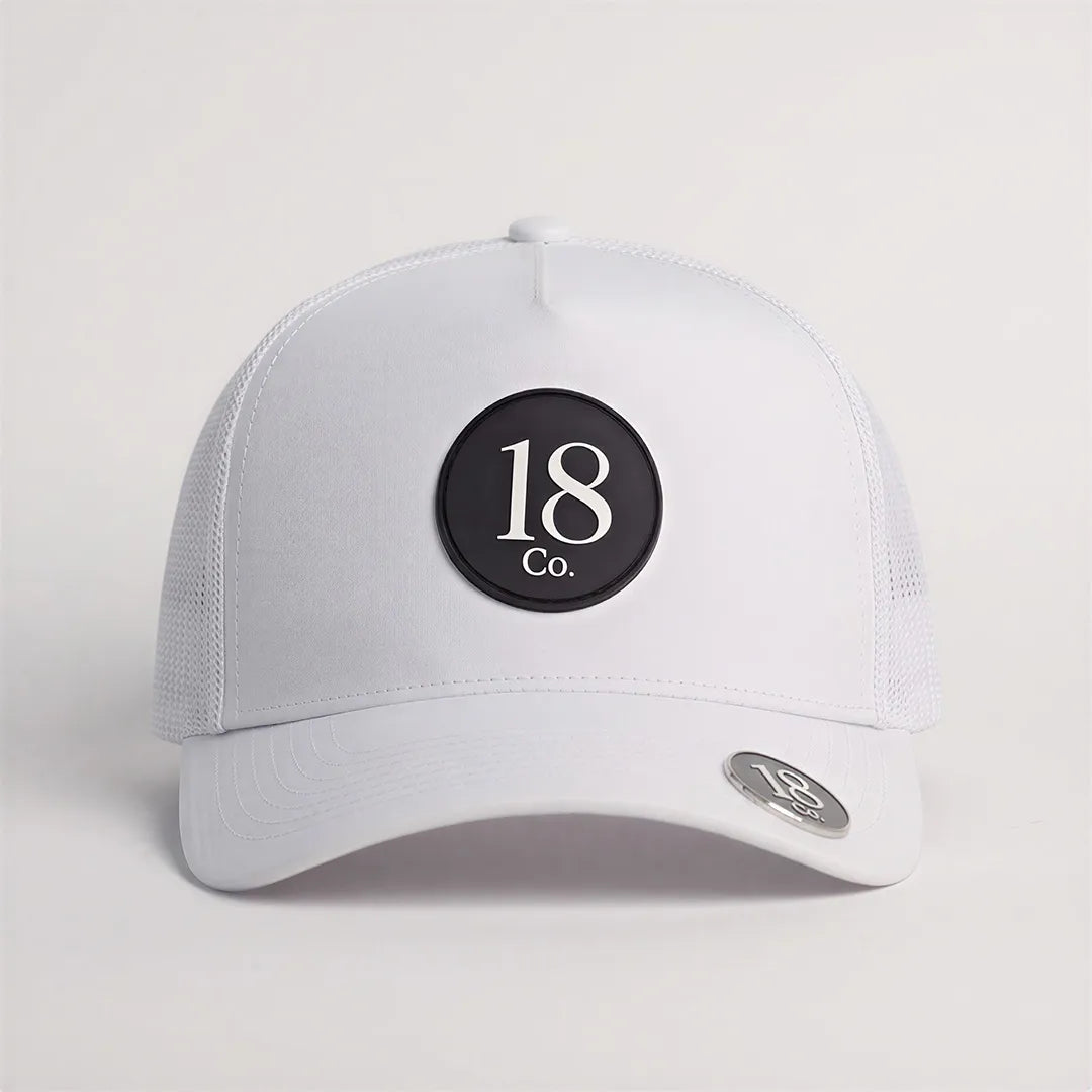 White 18 Co. Performance Golf Hat shown on course